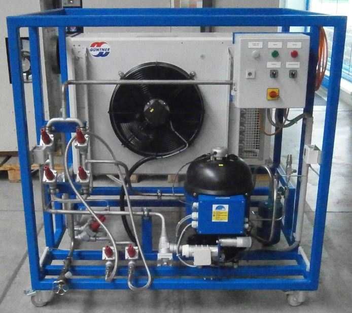 Ammonia refrigerant recovery unit showing compressor, control panel and condenser in a frame