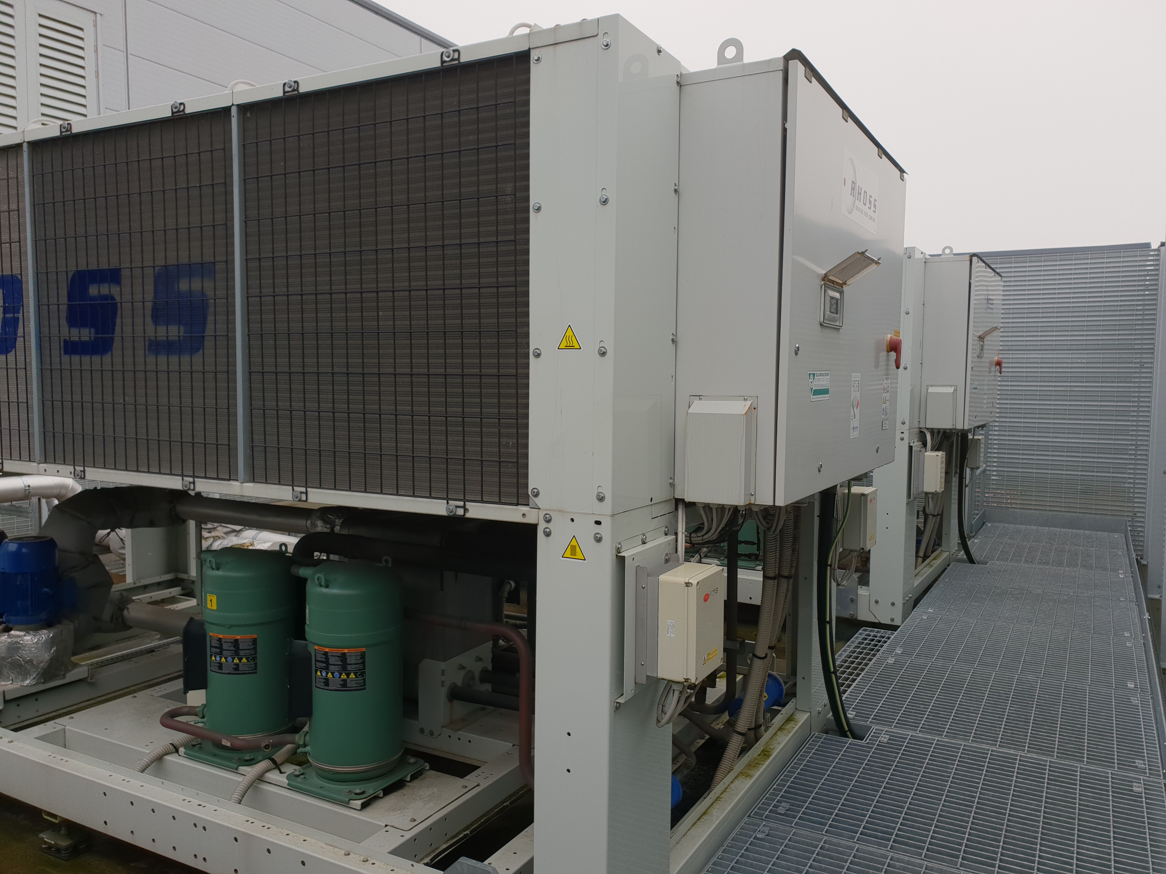Glycol chiller maintenance of two white chillers with green compressors
