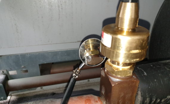 Mirror looking for leak during chilled water system eev service