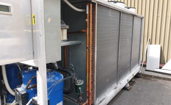 Chilled water system repair of condenser to a silver chiller with blue compressors