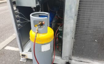 Chilling plant service showing yellow top recovery cylinder with gauge line and sight glass fitted