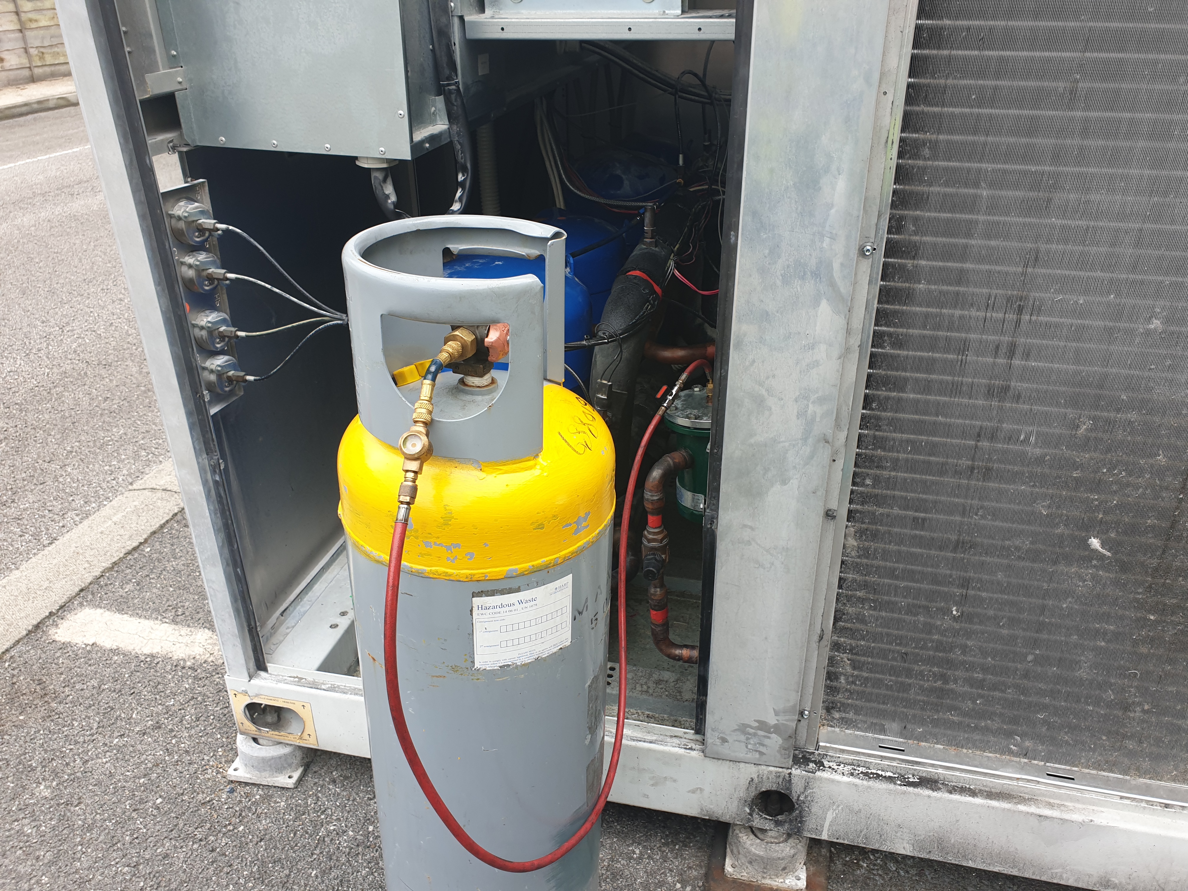 Chilling plant service showing yellow top recovery cylinder with gauge line and sight glass fitted