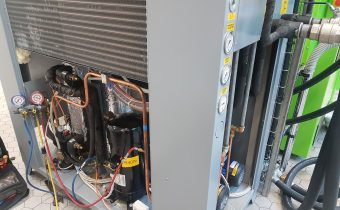 Process chiller maintenance of grey Italian chiller with cover removed