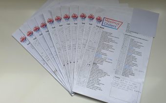 A pile of completed chiller maintenance checklists on a table
