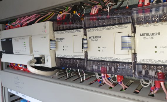 PLC and relay board in a panel during chiller service company visit