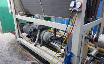 Nitrogen cylinder and regulator with gauges attached for f-gas chiller leak testing