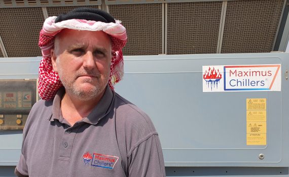 Engineer wearing Saudi headgear during chiller repair