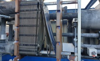 A plate evaporator with end plate removed during ammonia chiller repair