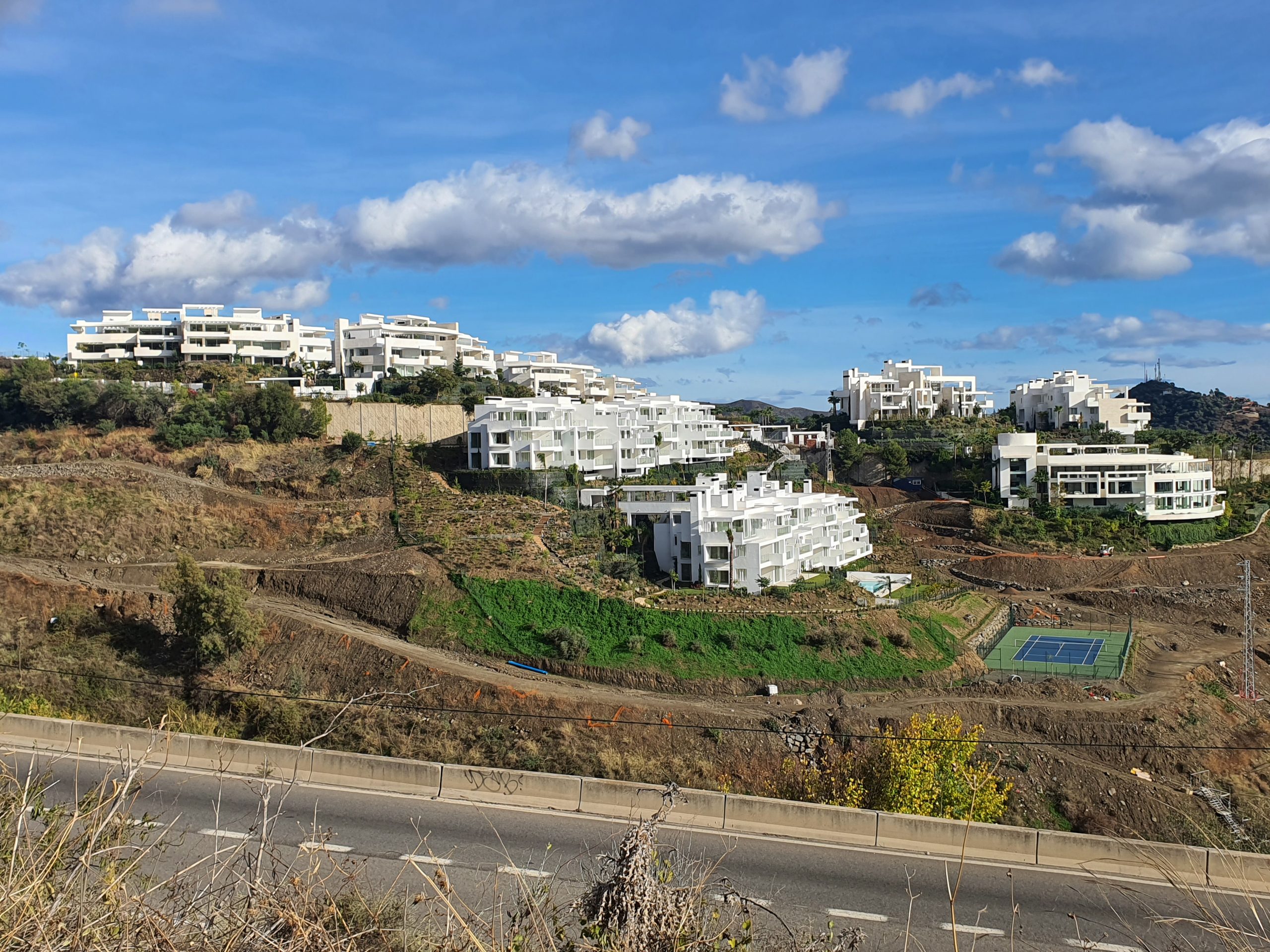 Chiller repair at a top market residential complex with white buildings on a hillside in Marbella